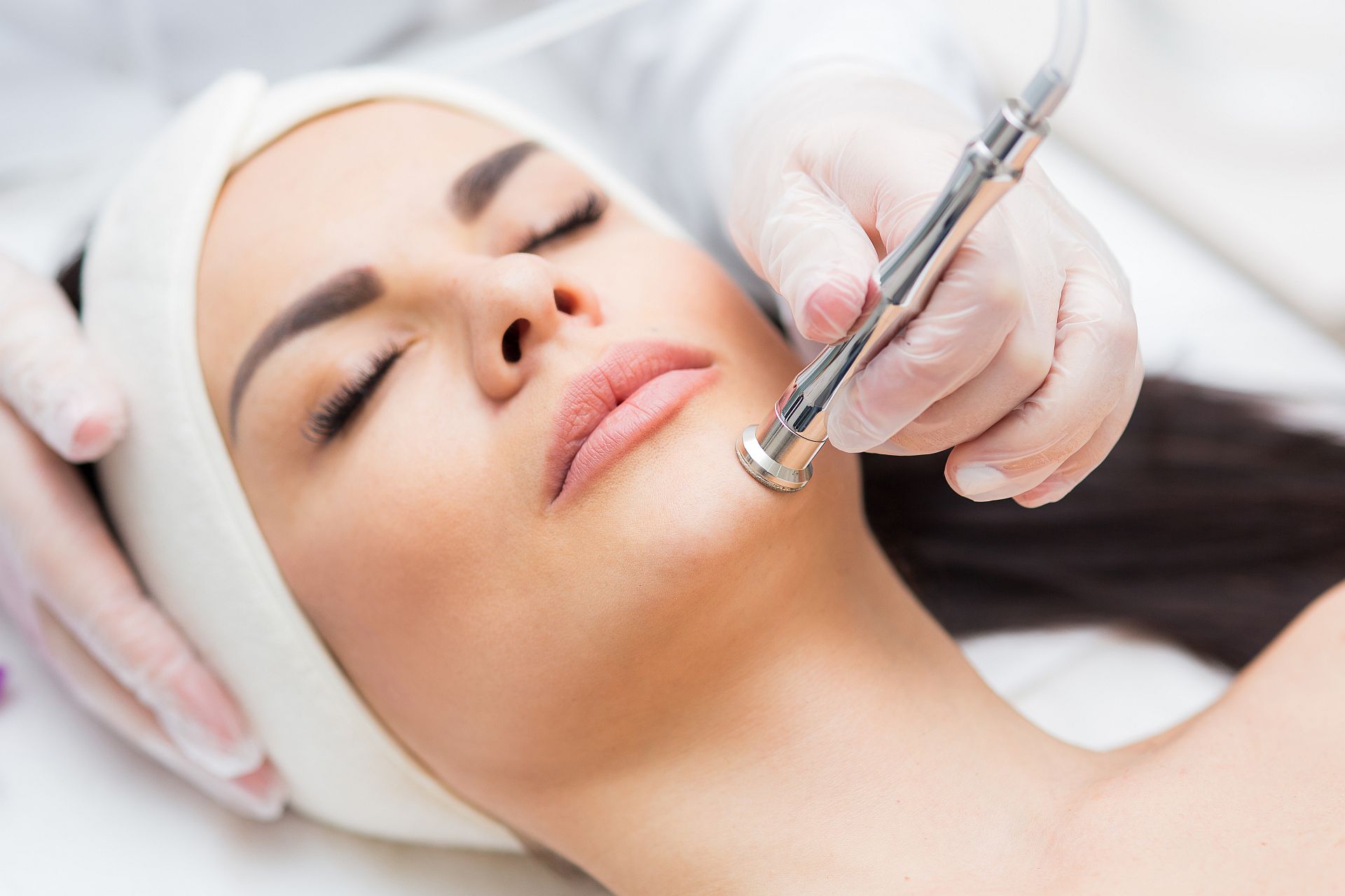 portrait of a woman receiving diamond microdermabrasion treatment